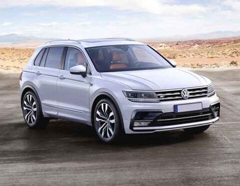 Silberner Volkswagen-SUV auf einer Straße in einer kargen Landschaft.